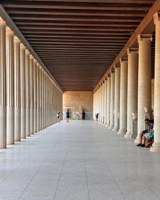 Inside a covered walkway in the Stoa of Attalos, between the first and second colonnades.